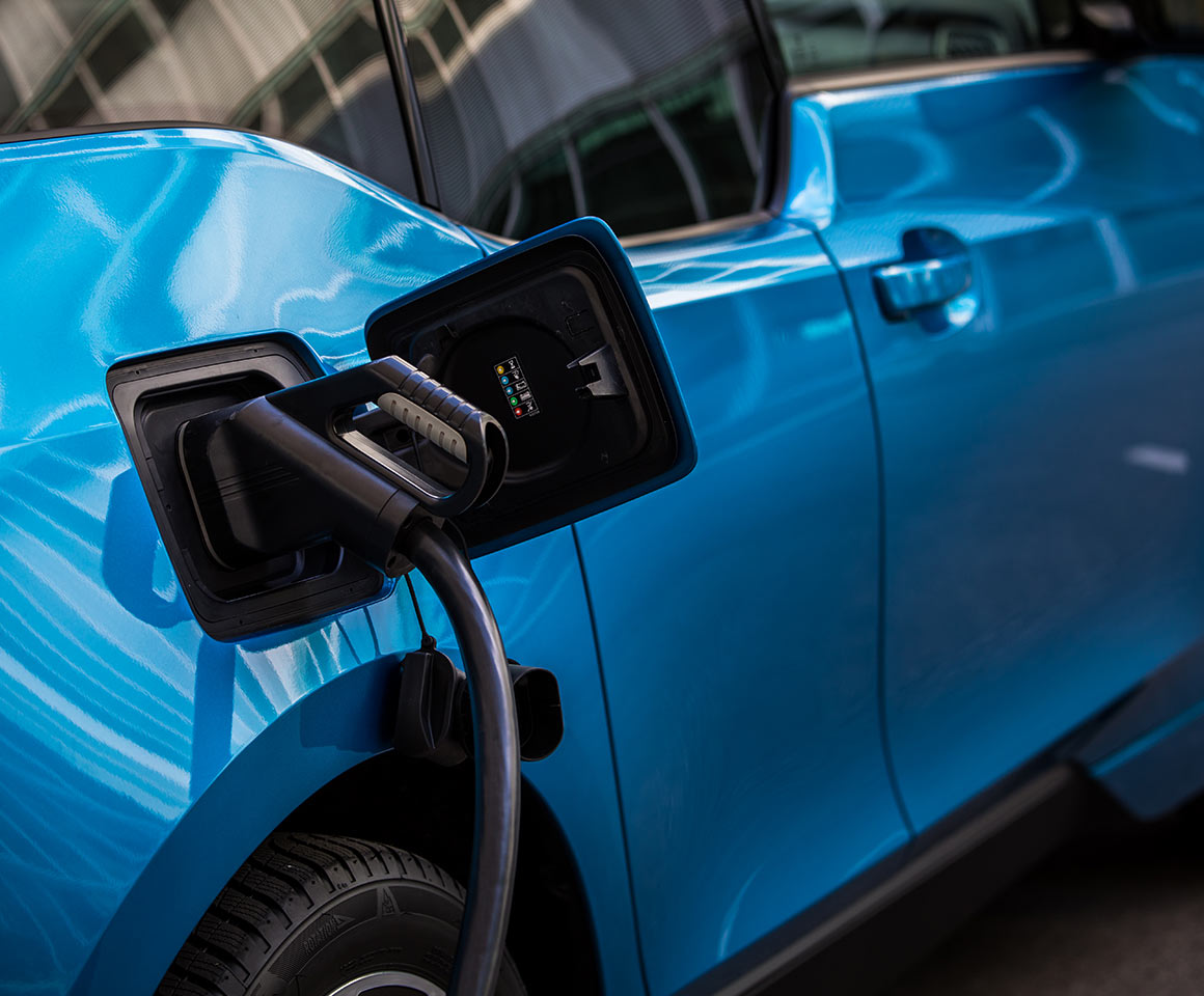 mage of electric vehicle charger hooked up to car