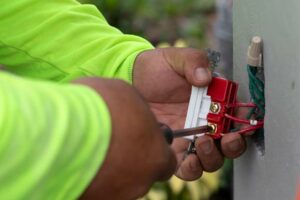 Electrician working on outside outlet in Lake Park, FL