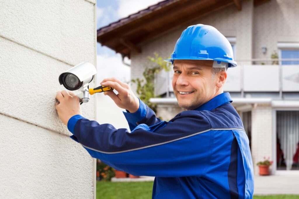 Electrician installing security cameras in Palm Beach County, FL