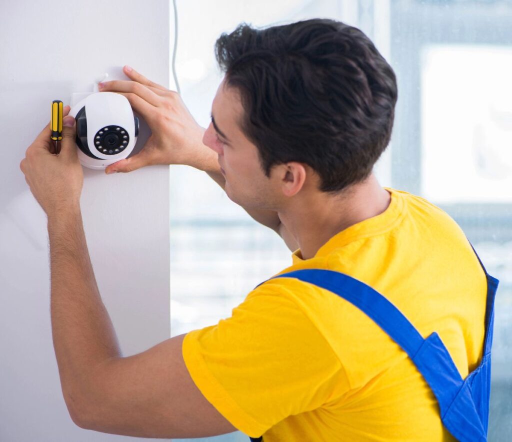 Residential electrician installing security cameras in Boynton Beach, FL